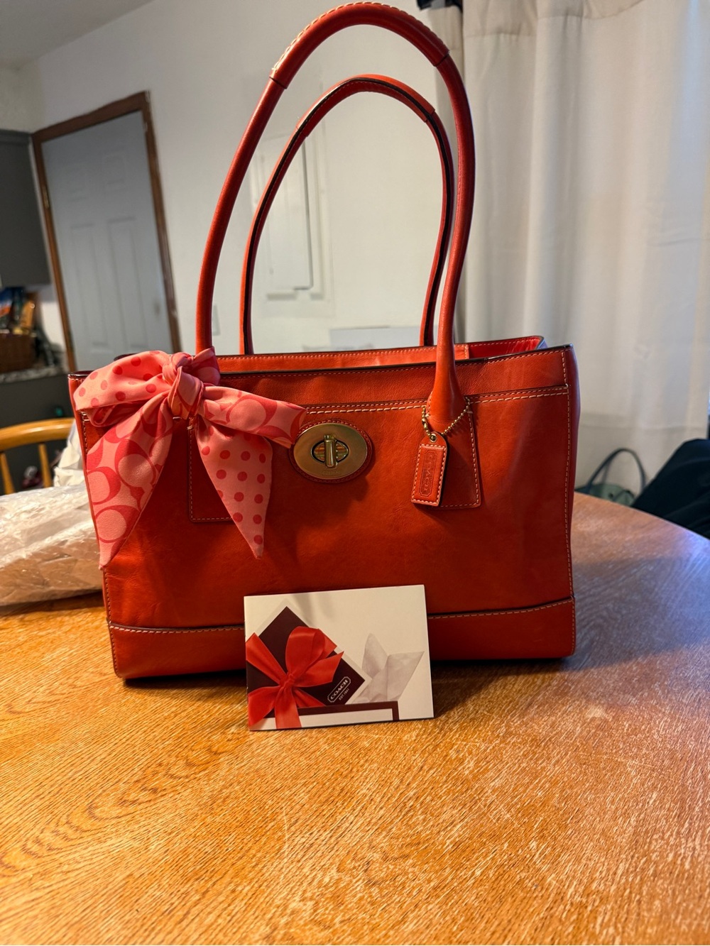 Coach Orange Leather Shoulder Bag with Pink Scarf Accent
